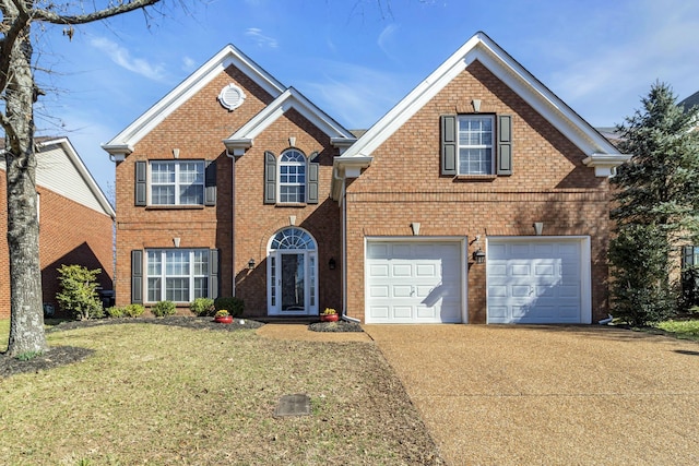 view of front facade featuring driveway, a garage, a front yard, and brick siding