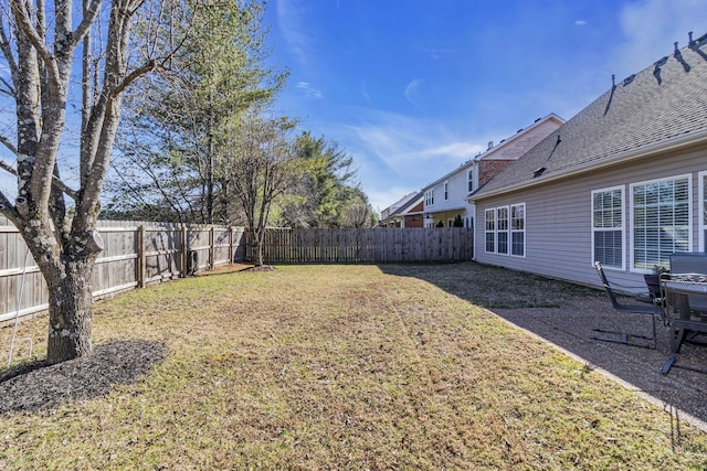 view of yard with a fenced backyard