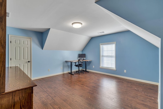 home office with lofted ceiling, wood finished floors, visible vents, and baseboards