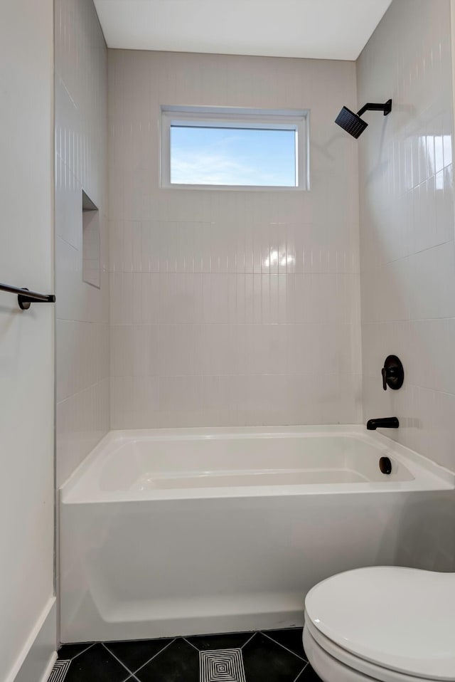 bathroom with shower / bath combination, toilet, and tile patterned floors