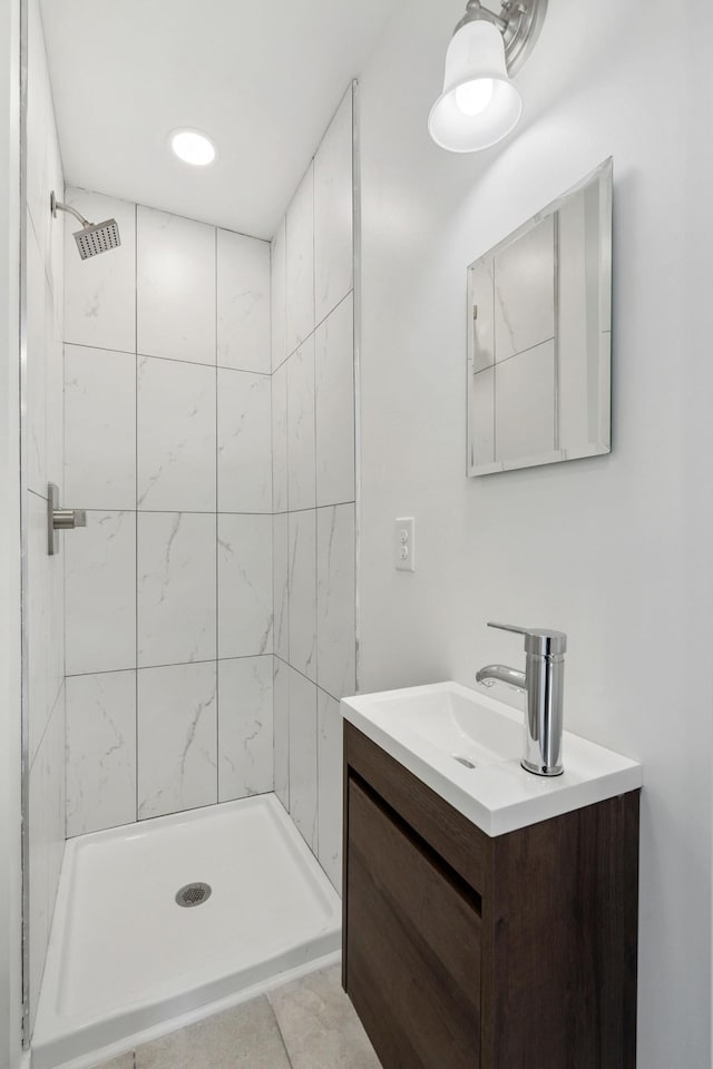 full bathroom featuring a shower stall and vanity