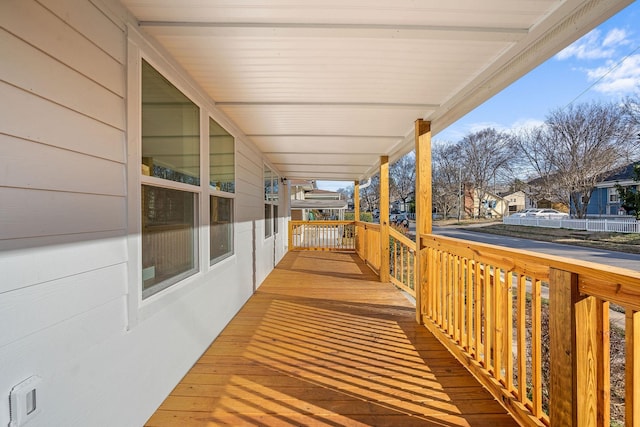 wooden terrace with a porch