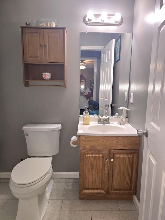 bathroom featuring vanity, tile patterned flooring, ensuite bath, and toilet