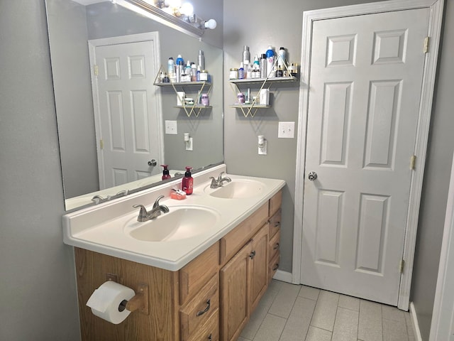 bathroom featuring a sink and double vanity