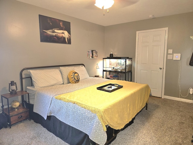 bedroom featuring a ceiling fan, carpet, and baseboards