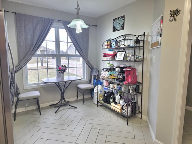 dining room with baseboards