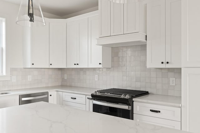 kitchen with range hood, stainless steel dishwasher, white cabinetry, backsplash, and gas stove