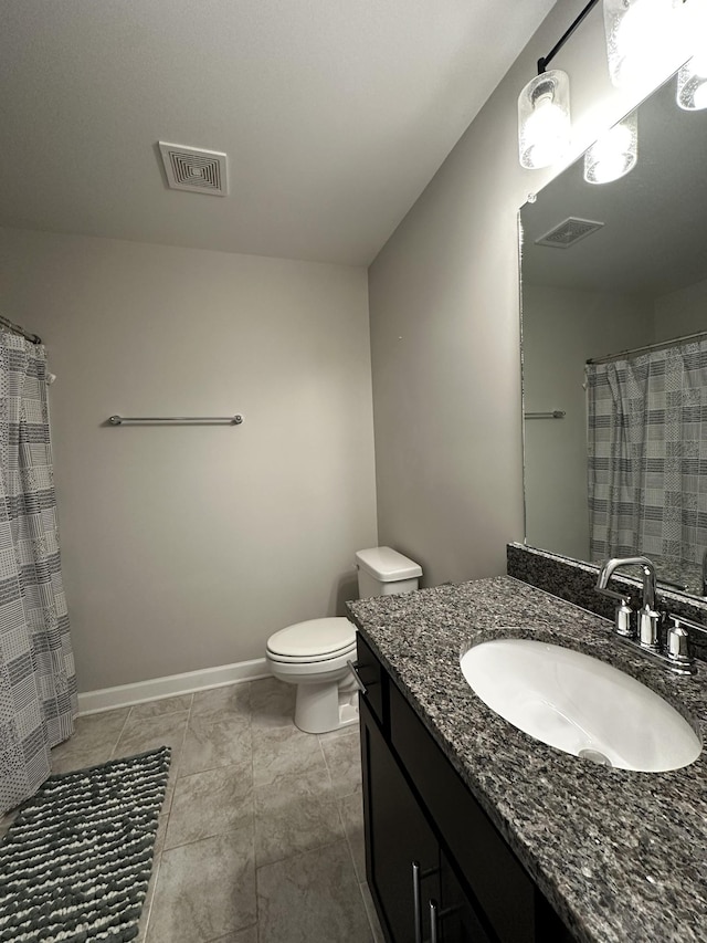 bathroom featuring toilet, baseboards, visible vents, and vanity