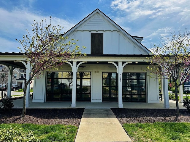 exterior space with a porch and board and batten siding