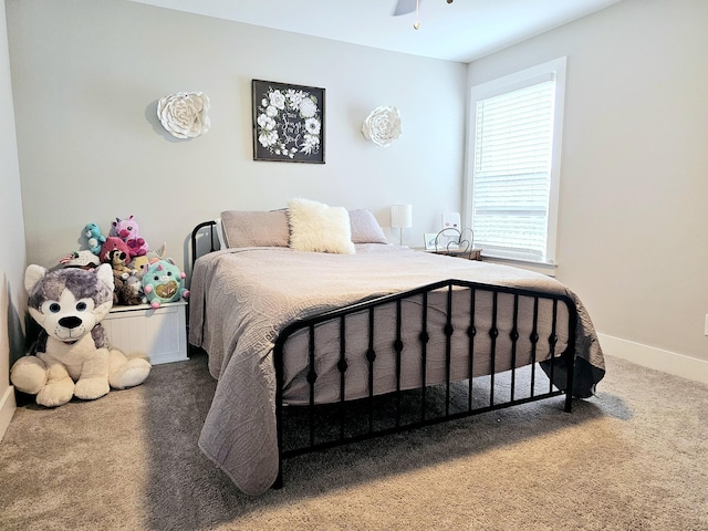 carpeted bedroom with baseboards