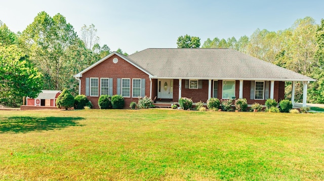 ranch-style house with a porch, a front lawn, and brick siding