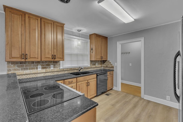 kitchen featuring a sink, decorative backsplash, dishwasher, light wood finished floors, and cooktop