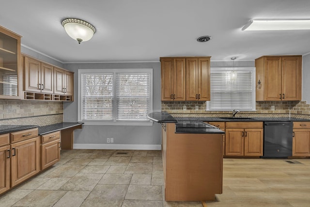 kitchen with brown cabinets, decorative backsplash, a sink, dishwasher, and baseboards