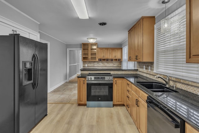 kitchen featuring dishwashing machine, a sink, black fridge with ice dispenser, stainless steel range with electric cooktop, and crown molding