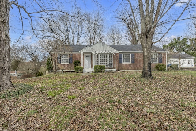 view of front of property with board and batten siding and brick siding