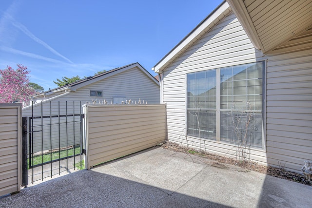 view of patio / terrace with fence and a gate
