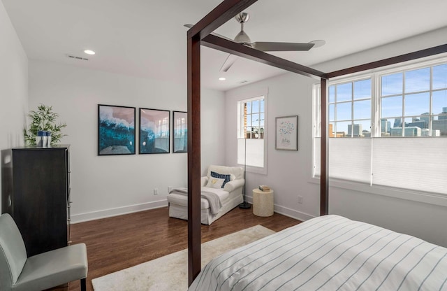 bedroom featuring recessed lighting, visible vents, baseboards, and wood finished floors