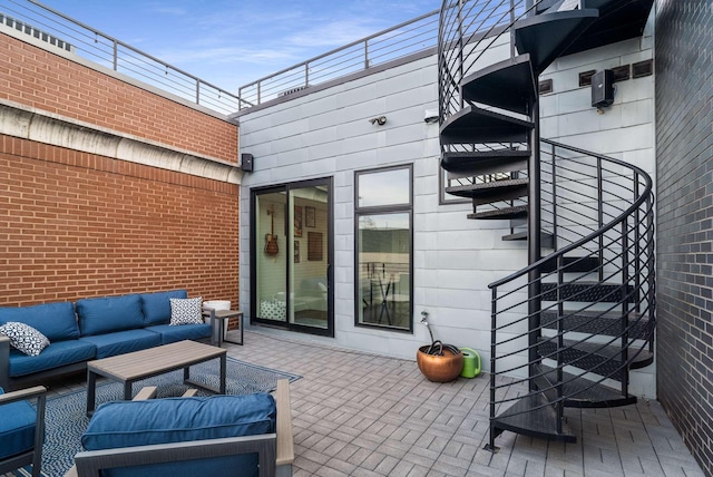 view of patio with stairway and outdoor lounge area