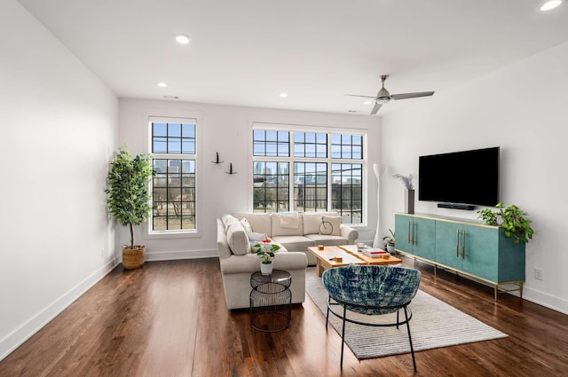 living room with recessed lighting, wood finished floors, a ceiling fan, and baseboards