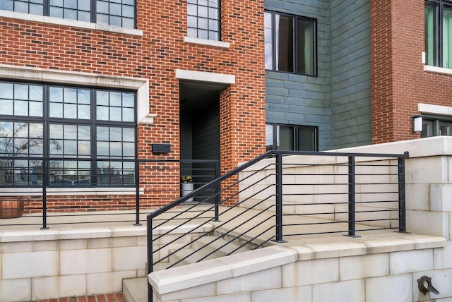 property entrance with brick siding