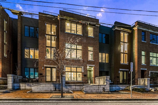 view of property at dusk