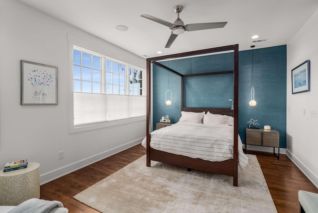 bedroom featuring a ceiling fan, recessed lighting, baseboards, and wood finished floors