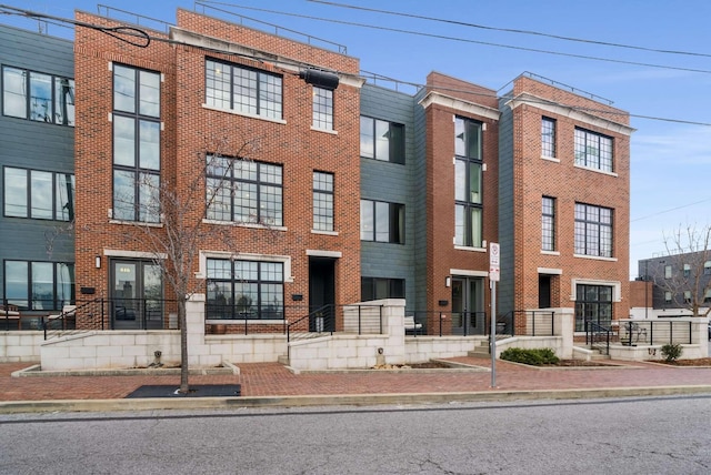 townhome / multi-family property with brick siding