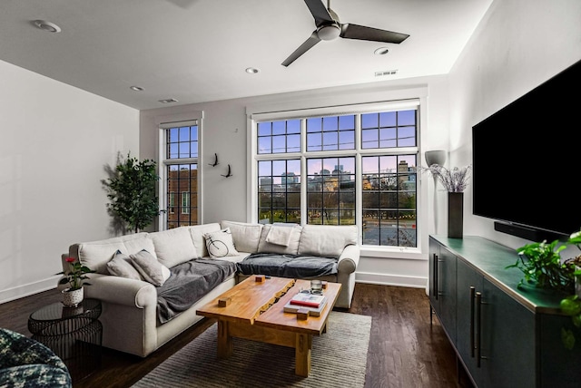 living area with dark wood finished floors, recessed lighting, visible vents, a ceiling fan, and baseboards