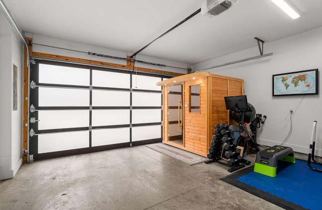 garage featuring baseboards and a garage door opener