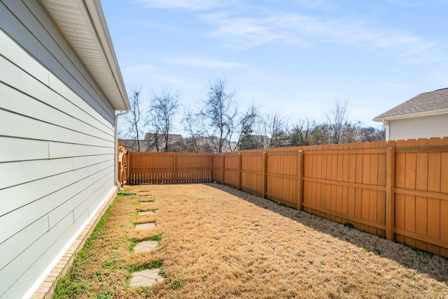 view of yard featuring a fenced backyard