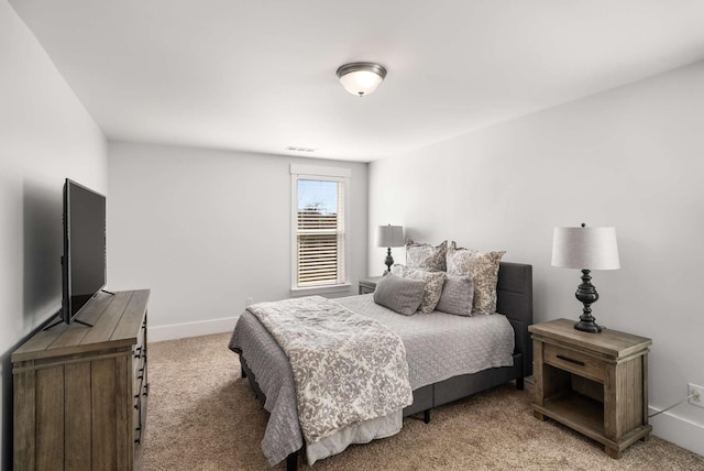 carpeted bedroom with baseboards