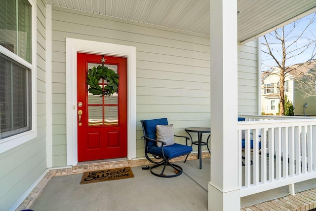 property entrance featuring covered porch