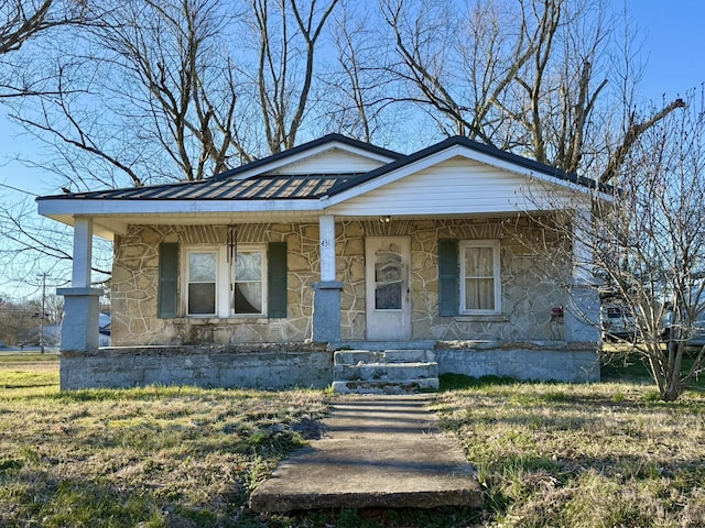 bungalow-style home featuring stone siding and a porch