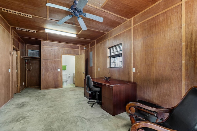 office space with ceiling fan, wood walls, wooden ceiling, and concrete flooring