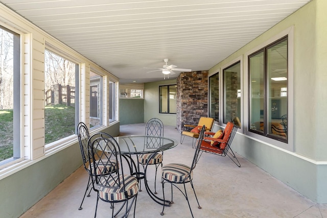 sunroom featuring ceiling fan