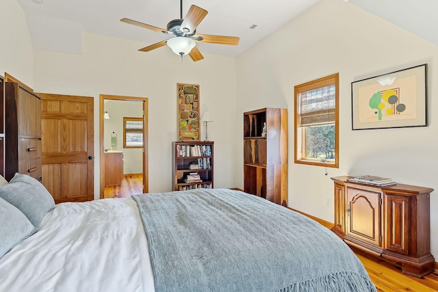 bedroom with light wood-style floors, ceiling fan, and baseboards