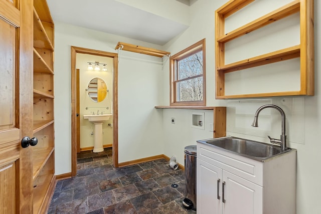 laundry area featuring washer hookup, stone finish floor, a sink, electric dryer hookup, and baseboards