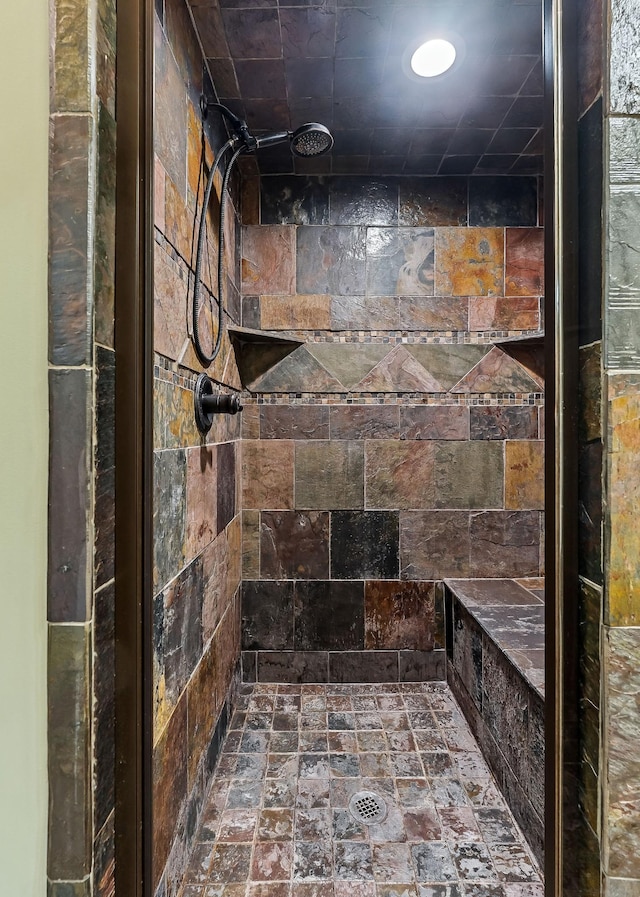 full bath featuring tiled shower