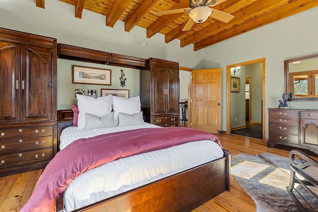 bedroom featuring a ceiling fan, wooden ceiling, beamed ceiling, and wood finished floors