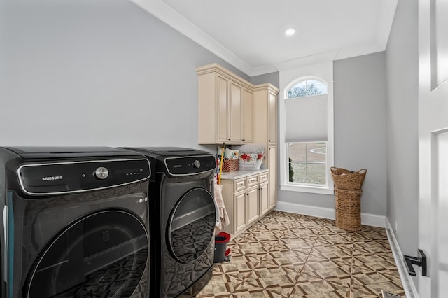 washroom with ornamental molding, a healthy amount of sunlight, cabinet space, and independent washer and dryer