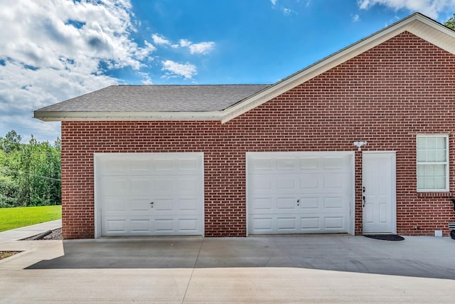 garage featuring driveway