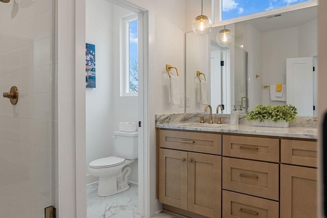 full bathroom featuring visible vents, toilet, marble finish floor, vanity, and a shower stall