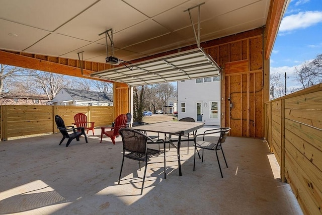 view of patio / terrace with outdoor dining space and fence