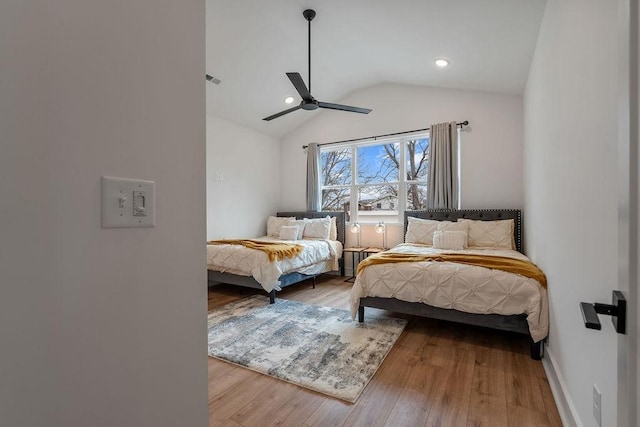 bedroom featuring recessed lighting, ceiling fan, vaulted ceiling, wood finished floors, and baseboards