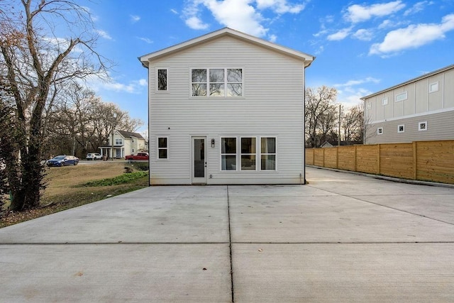 back of house with a patio area and fence