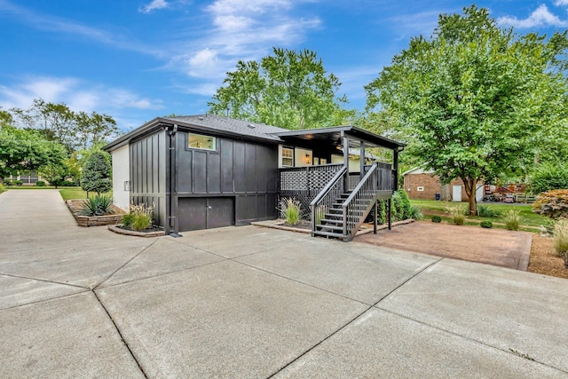 exterior space with stairway and board and batten siding