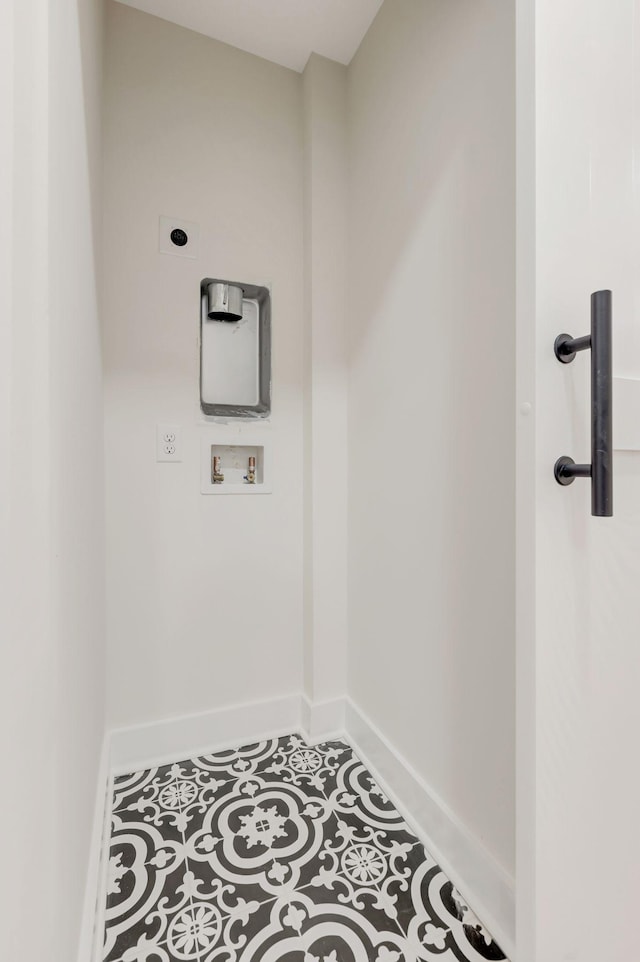 laundry area featuring tile patterned flooring, laundry area, washer hookup, baseboards, and electric dryer hookup