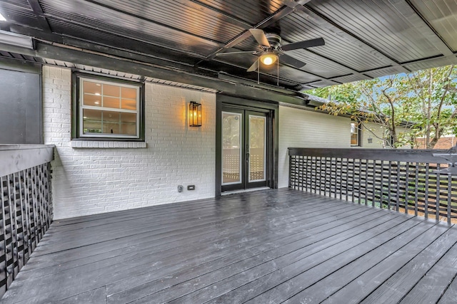 wooden deck with a ceiling fan