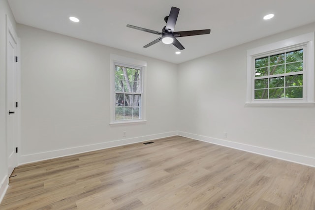 empty room with baseboards, recessed lighting, and a healthy amount of sunlight