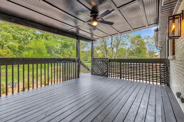 wooden deck featuring a ceiling fan